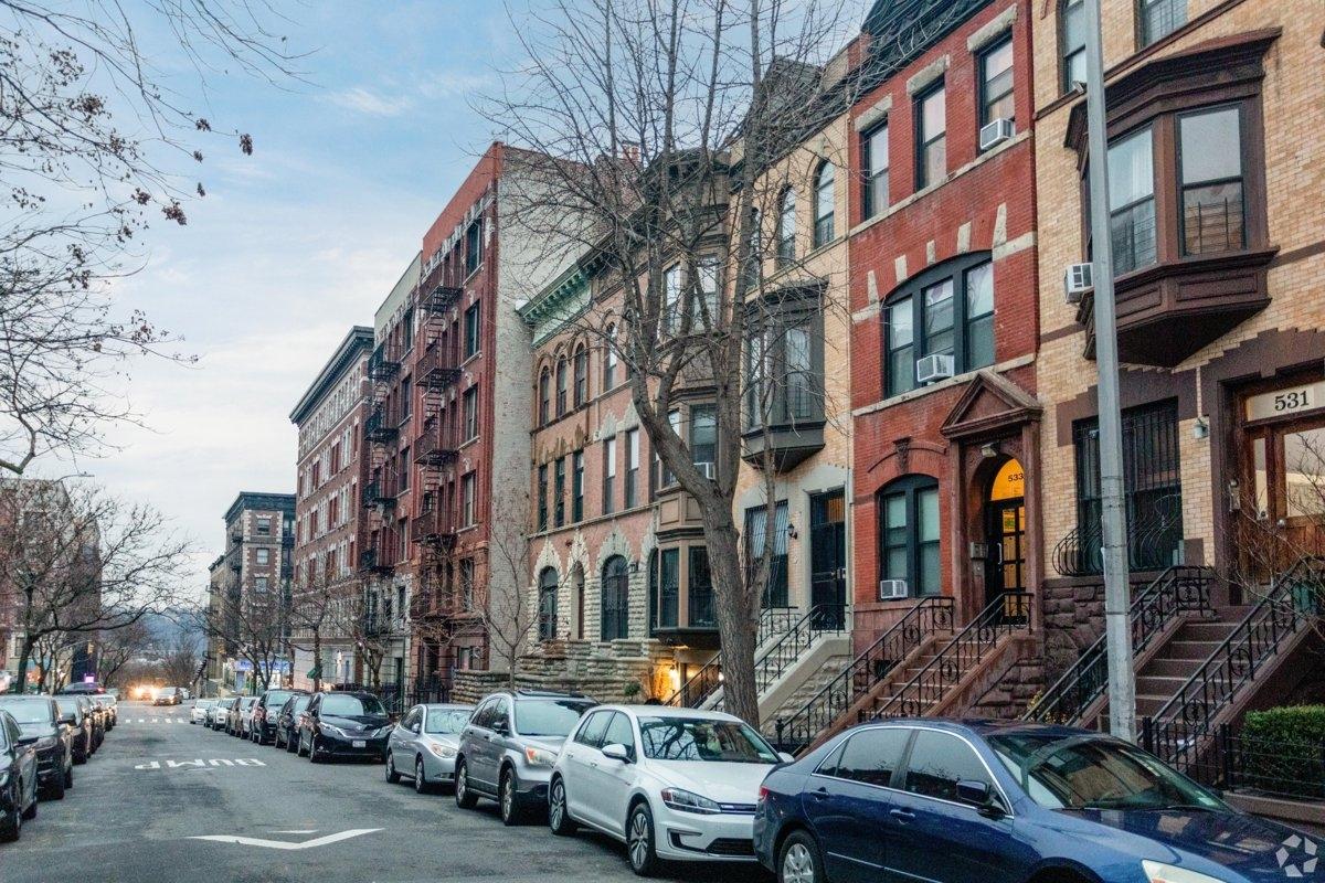 Beautiful brick brownstones on a street in Hamilton Heights