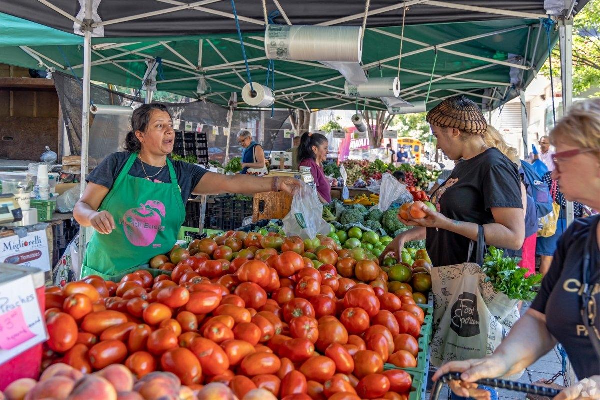 Food vendors selling vegetables on streets in Washington Heights
