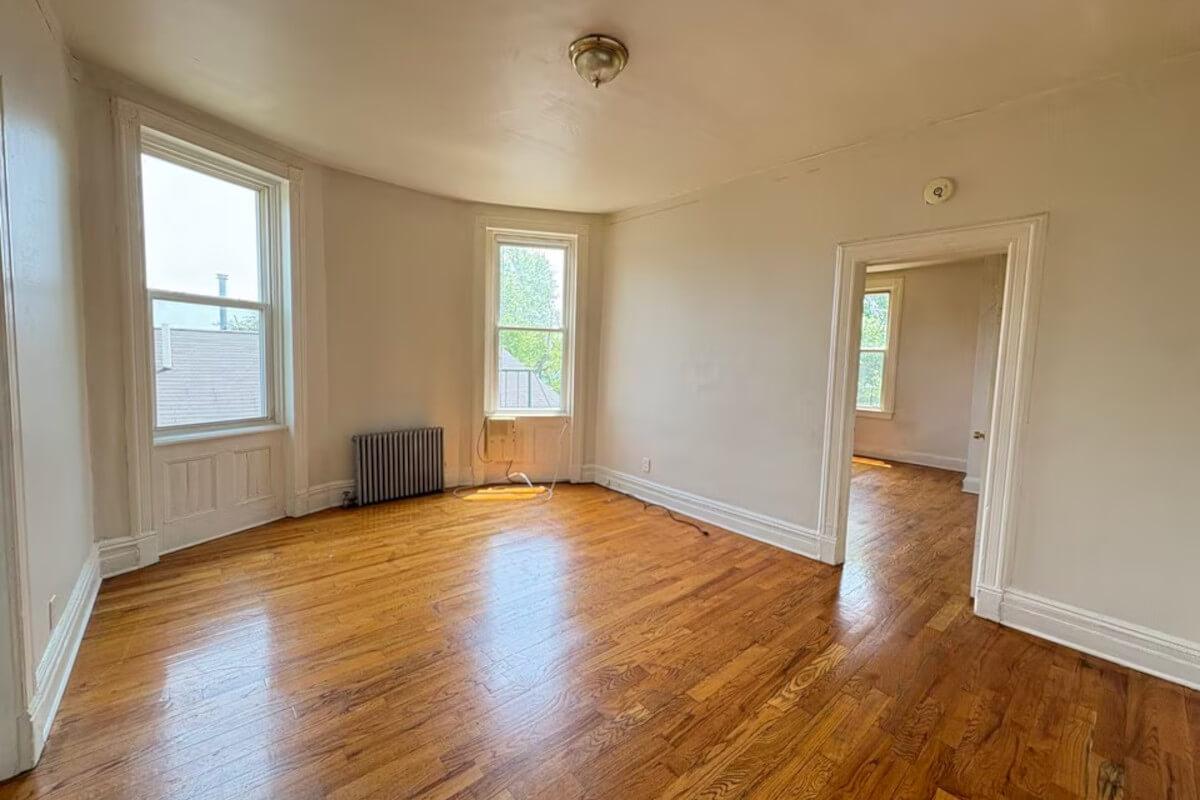 387 Forrest St Unit 7 has wood flooring and natural light.