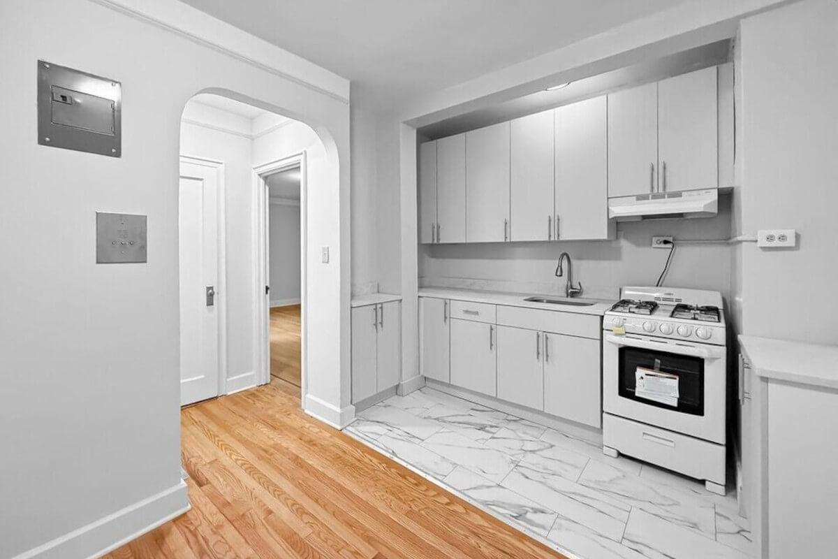 1685 E 5th St has arched doorways and wood flooring.