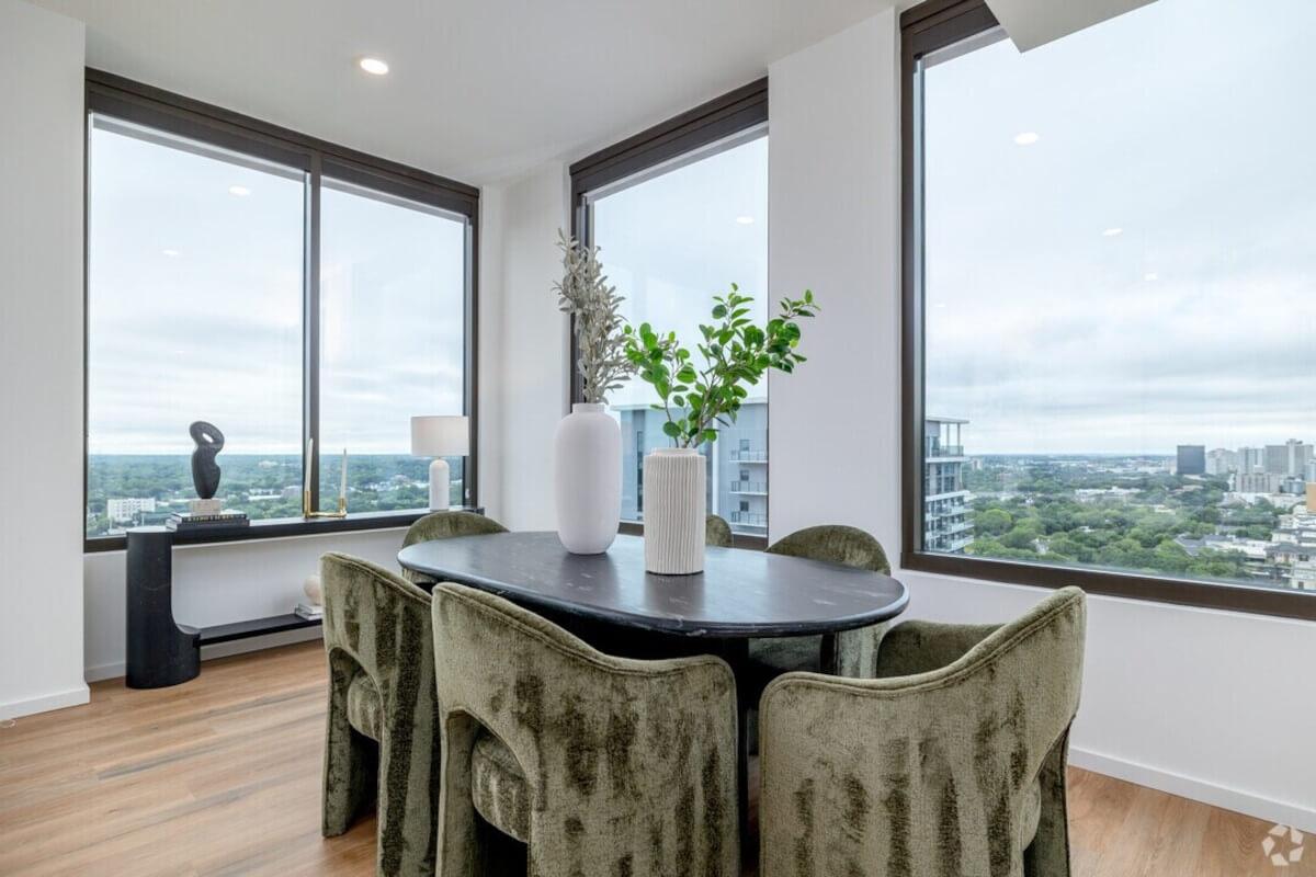 A dining area at The Juniper in Atlanta overlooks the city.
