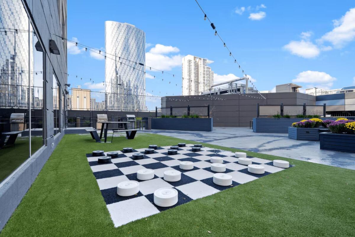 The community courtyard at Presidential Towers in Chicago, IL, has a life-size checkers board.