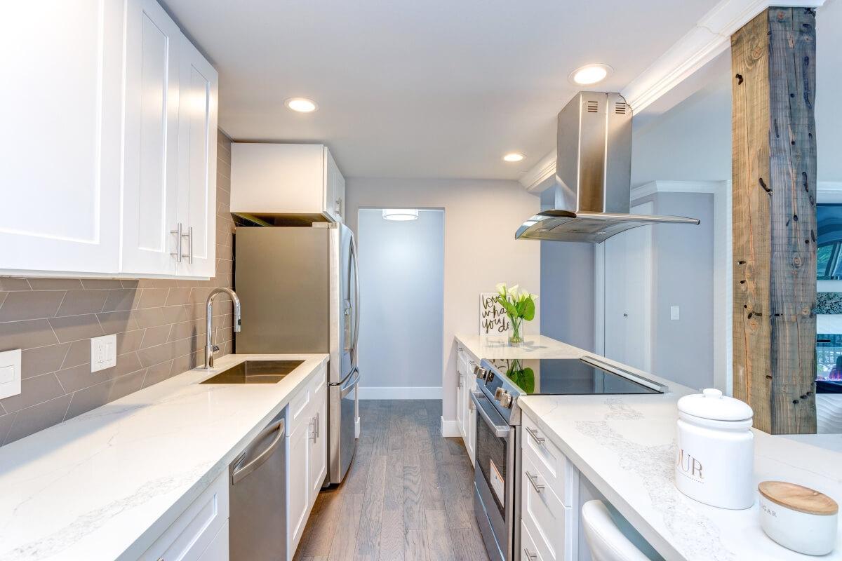 Stainless steel appliances in a luxury apartment kitchen.