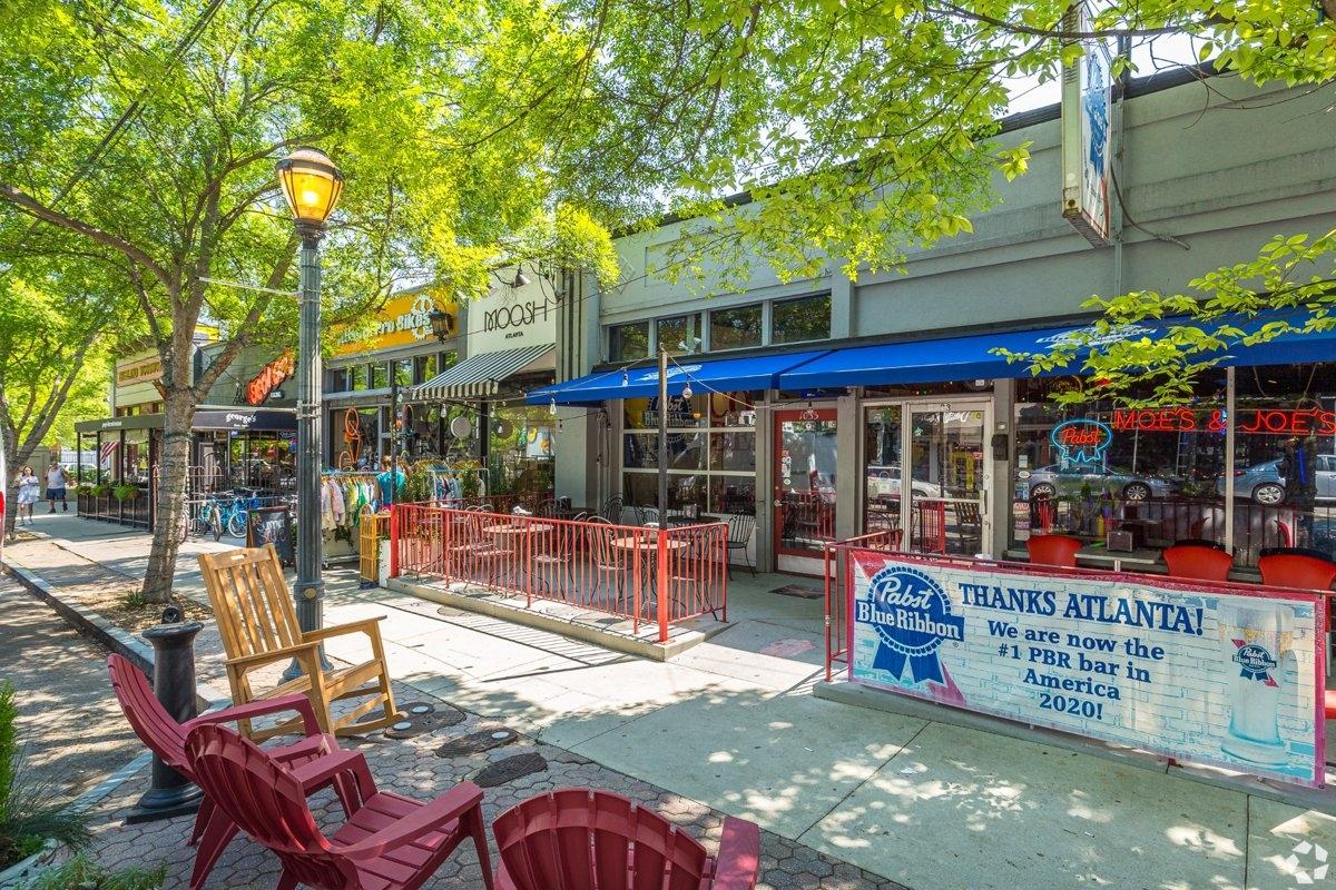 A colorful row of shops and restaurants on street in Virginia Highland
