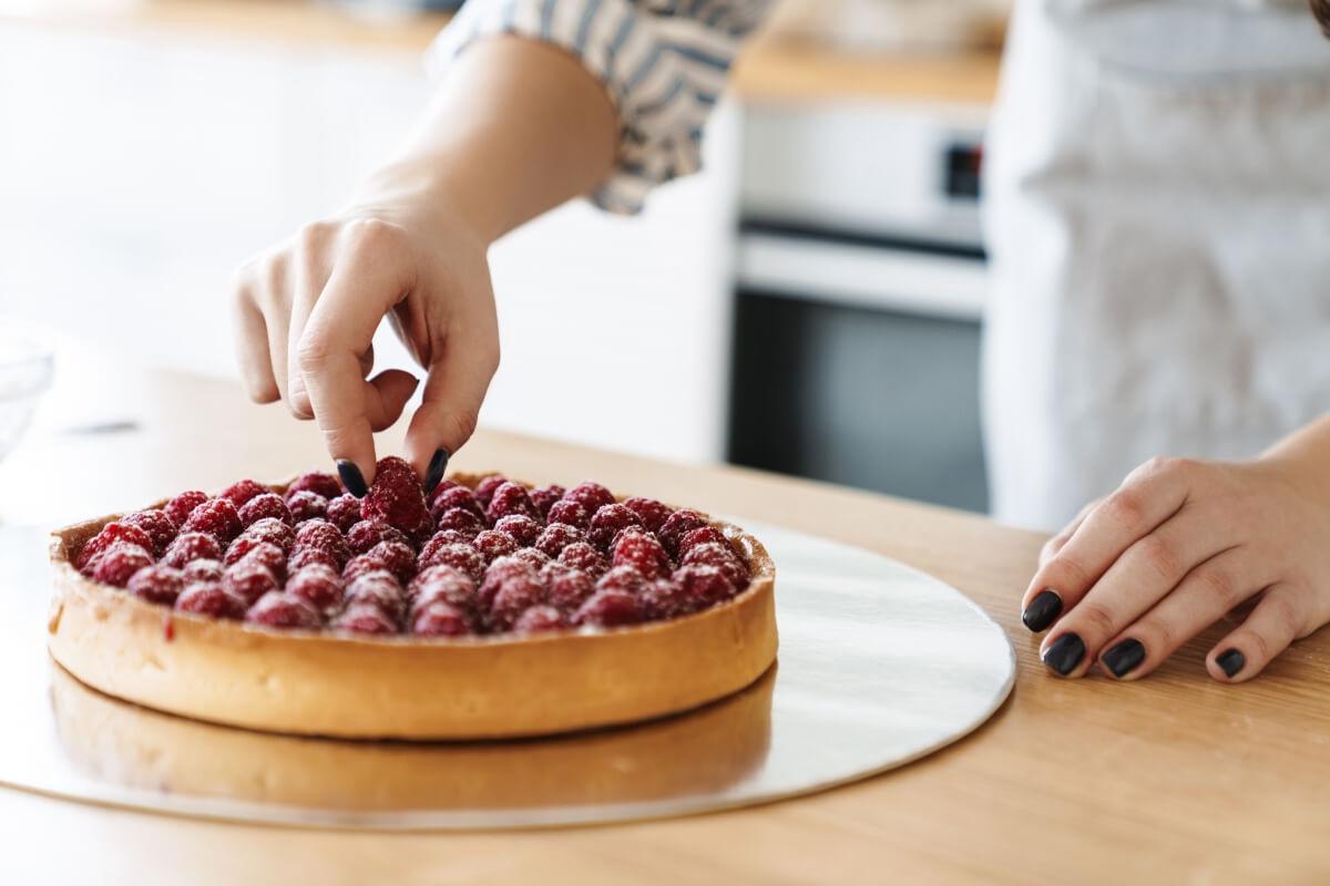 A person making a cranberry dessert