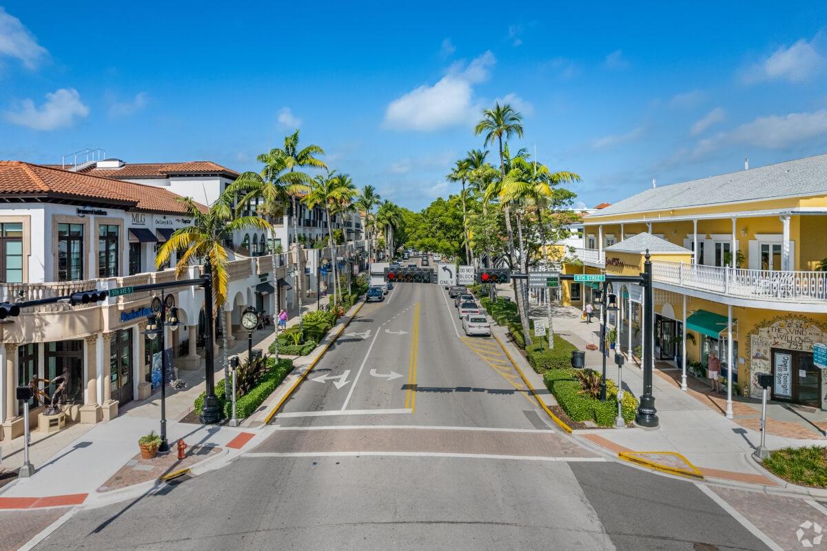Palm trees line 5th Avenue in Downtown Naples.
