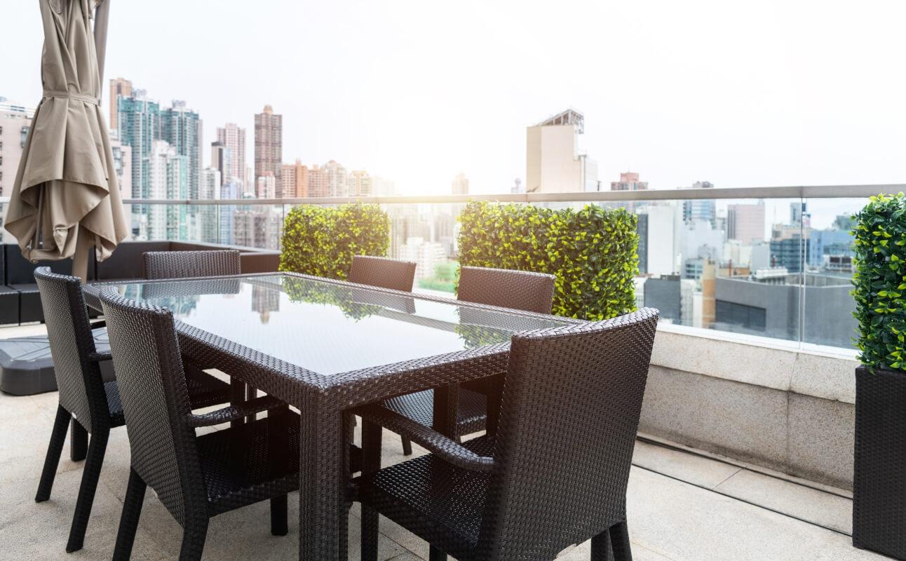 A table and chairs on a building rooftop