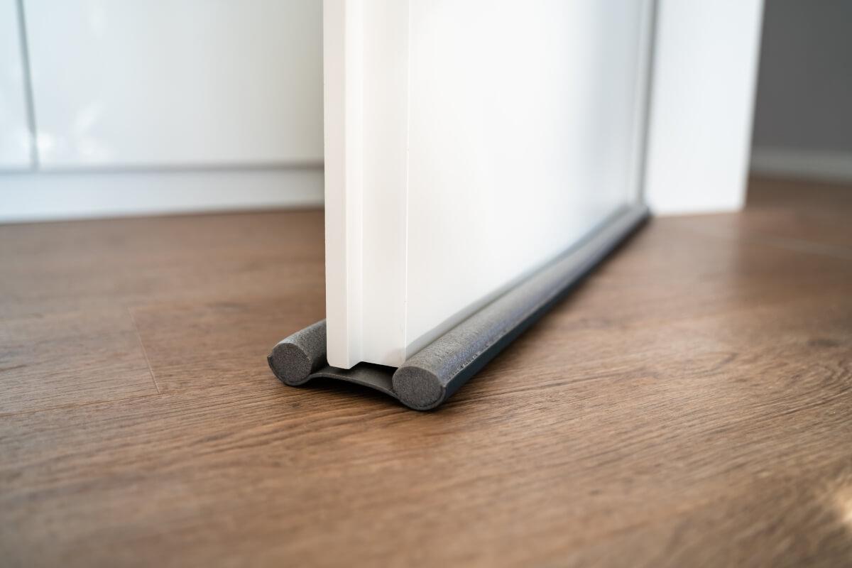 A draft stopper on the bottom of an interior door.
