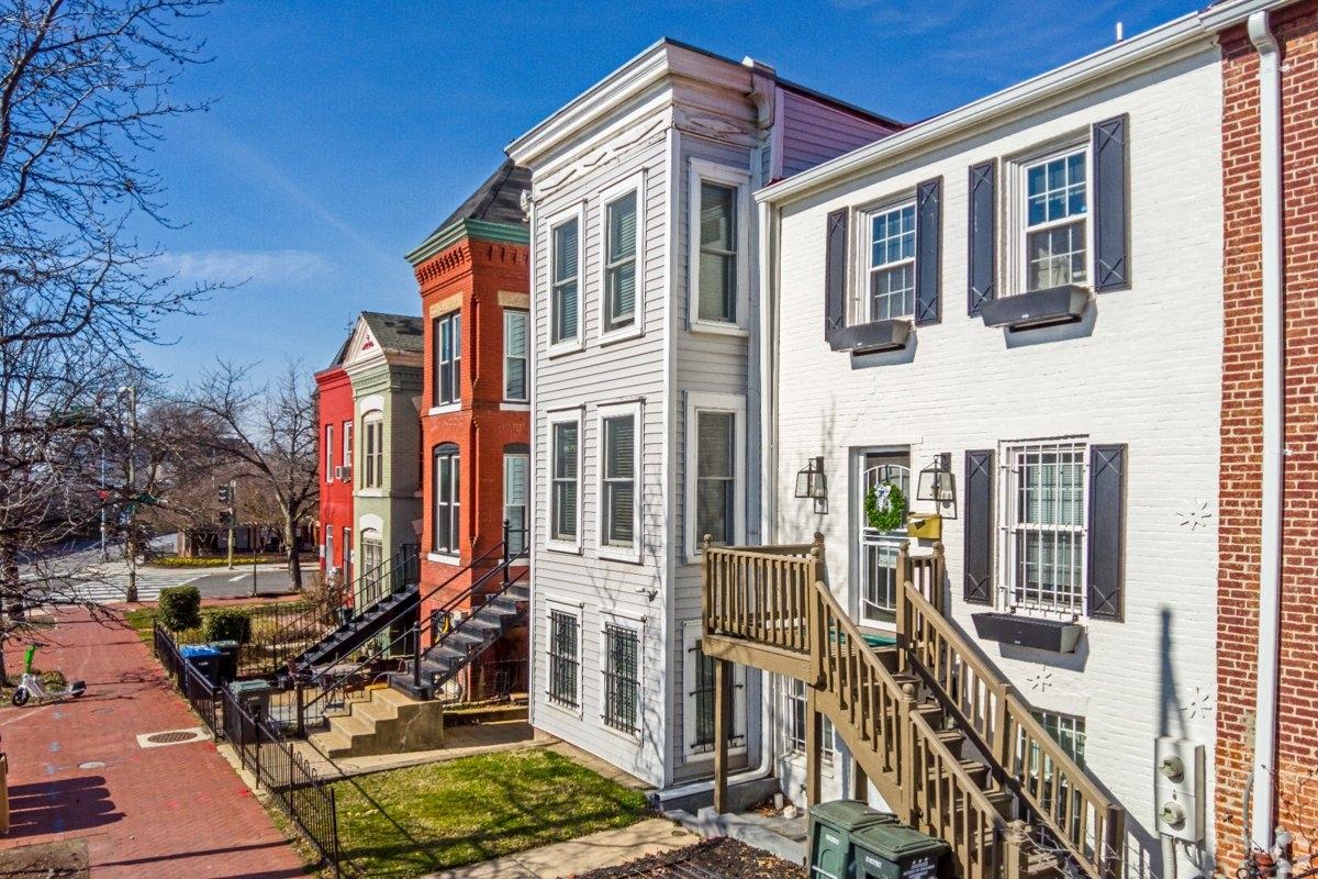 Capitol Hill in Washington, D.C. featuring a residential street of 3-story homes