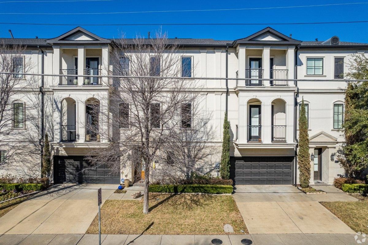 Two-story, white colored townhomes in the Oak Lawn neighborhood