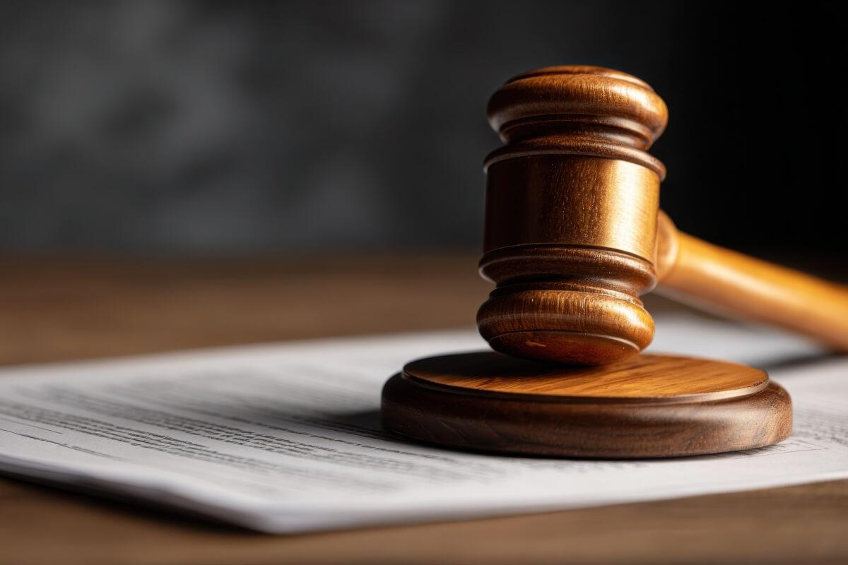 A close-up shot of a gavel on a desk.