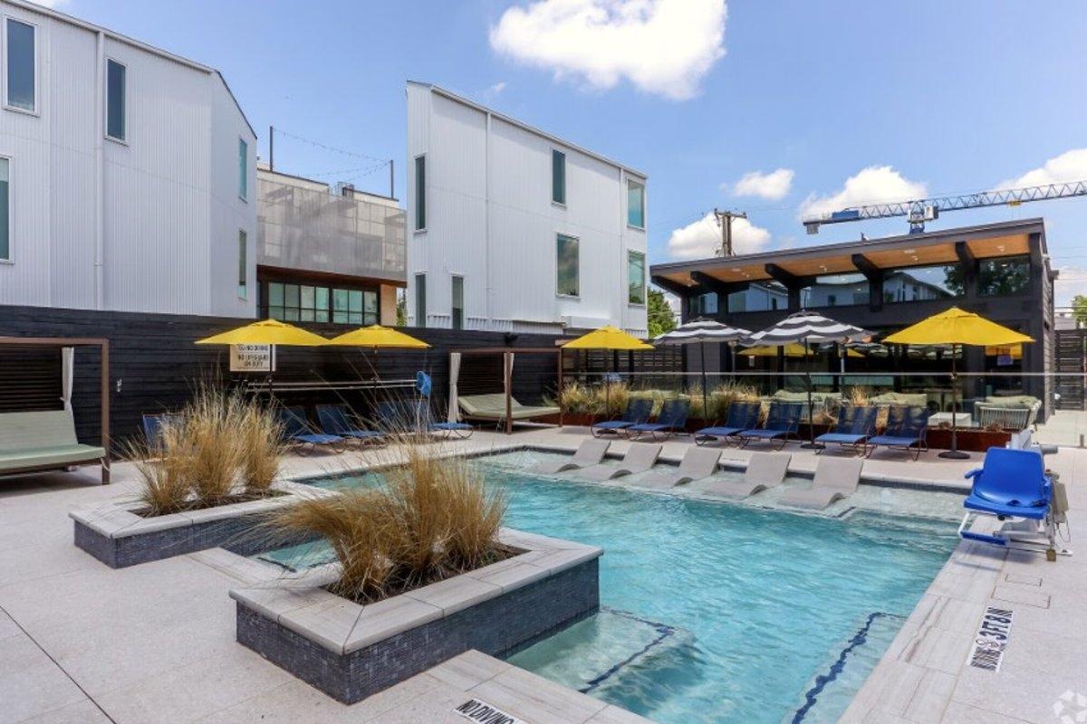 Townhomes surrounding a pool in Knox-Henderson