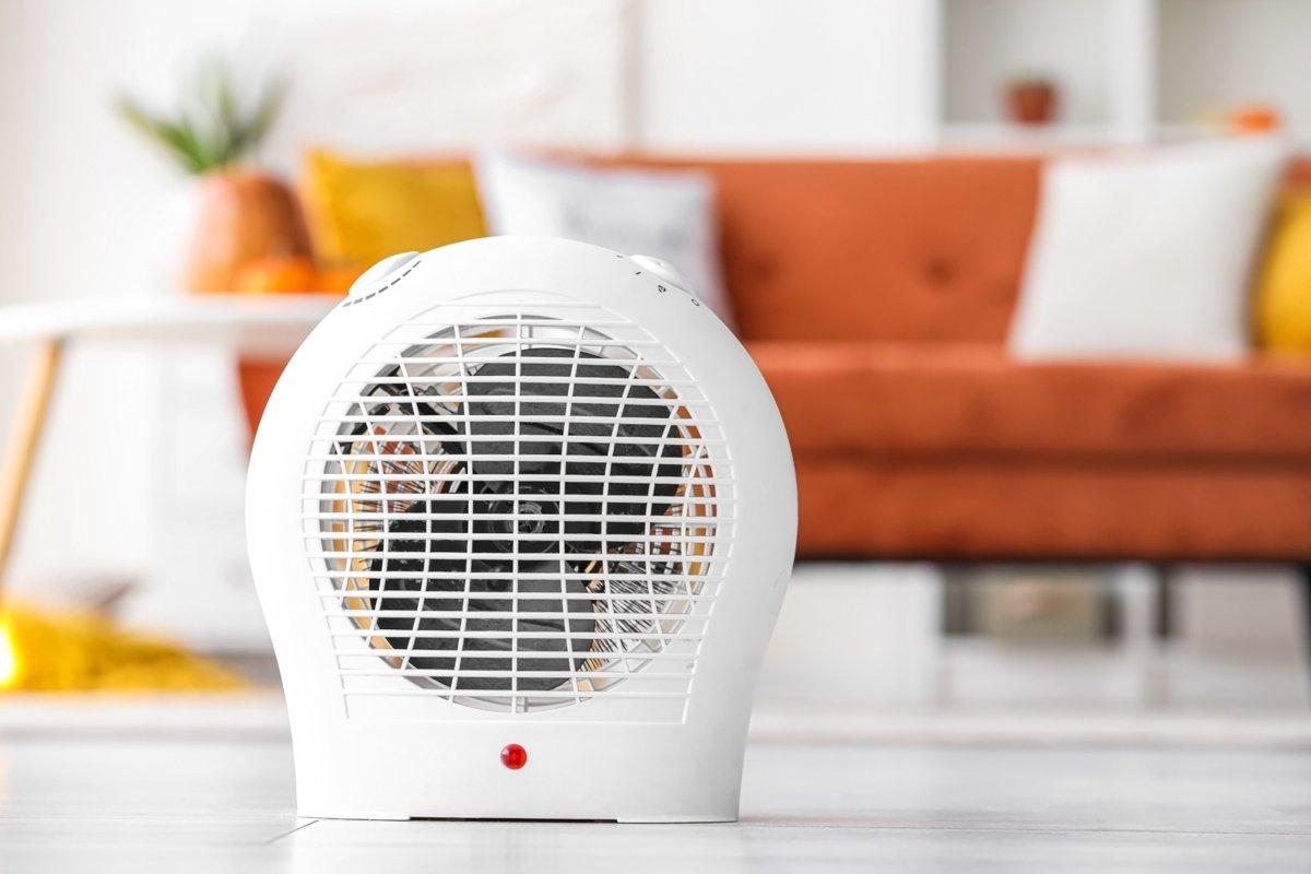A space heater sitting on the living room floor