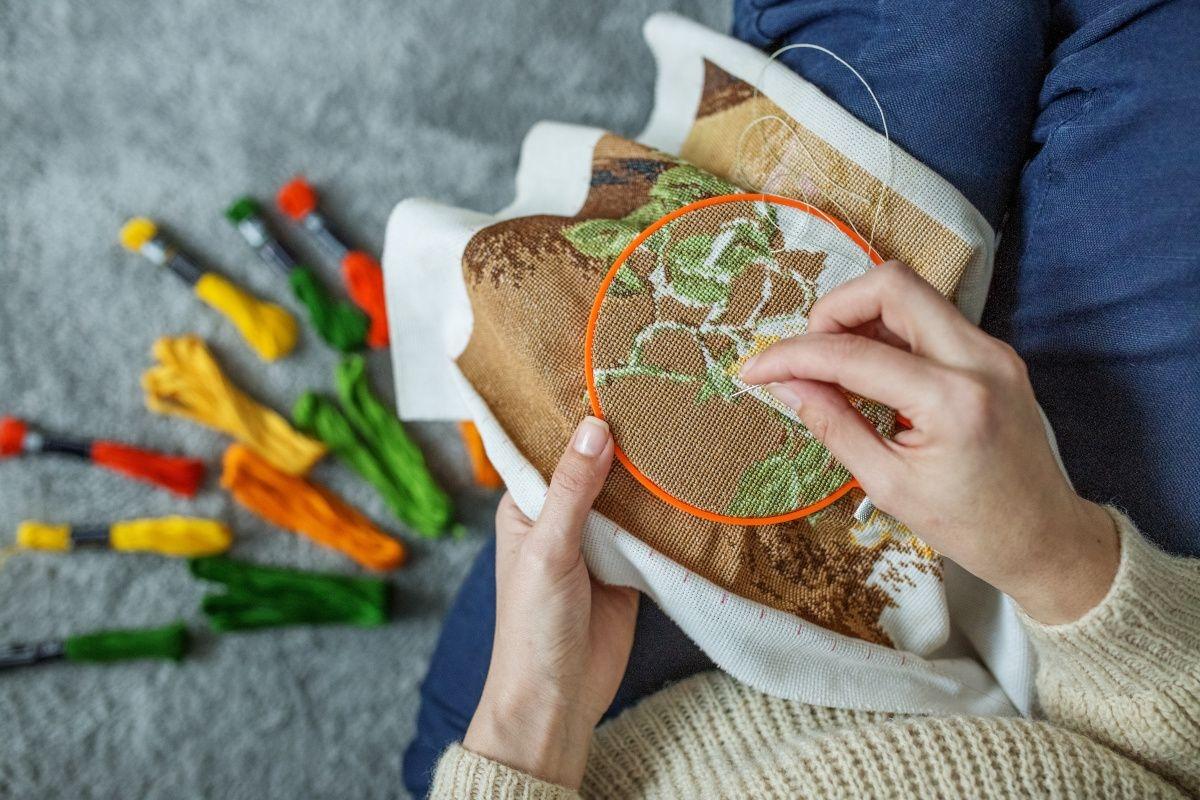 Woman does arts and crafts at home.