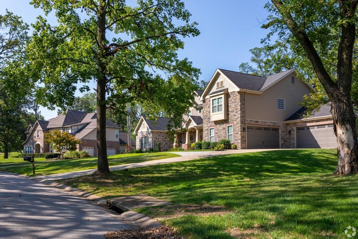 A tree-lined street of multi-family homes in Olivette