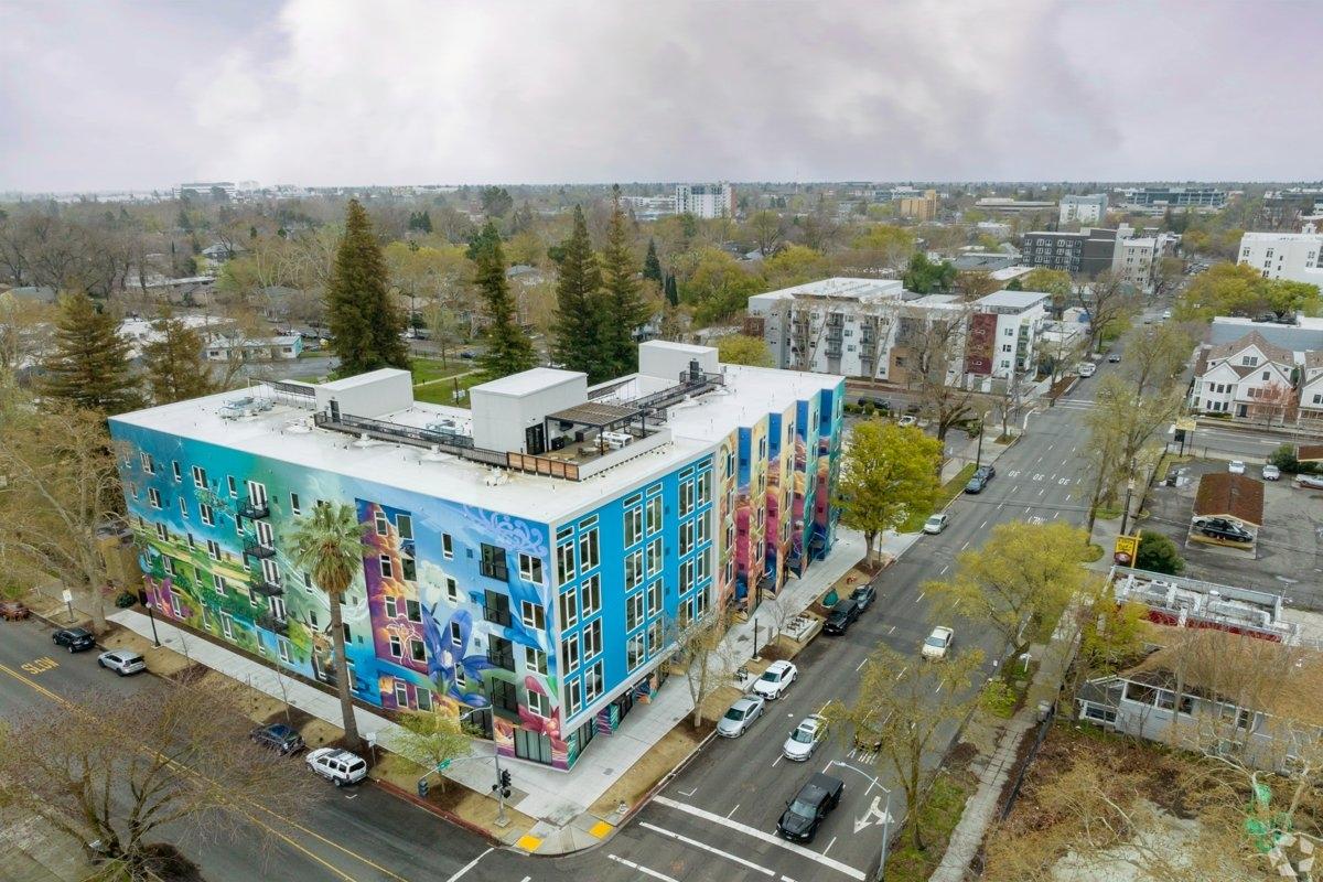 A colorful residential building on a main street in Boulevard Park