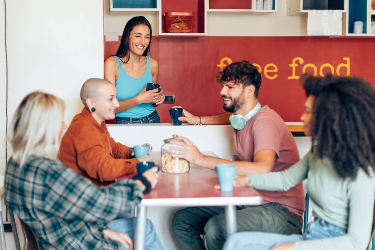 Residents chat in their coliving space.