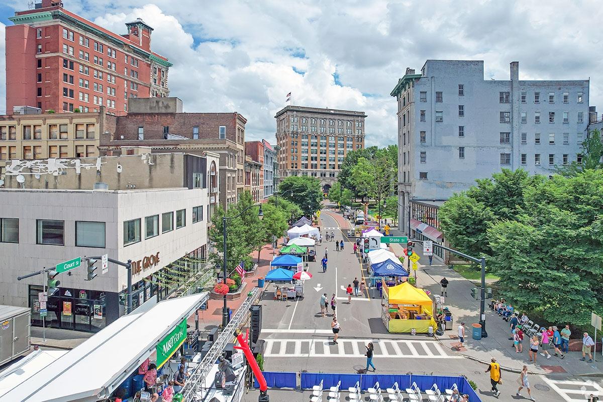 People meander around tents during a festival in Downtown Binghamton