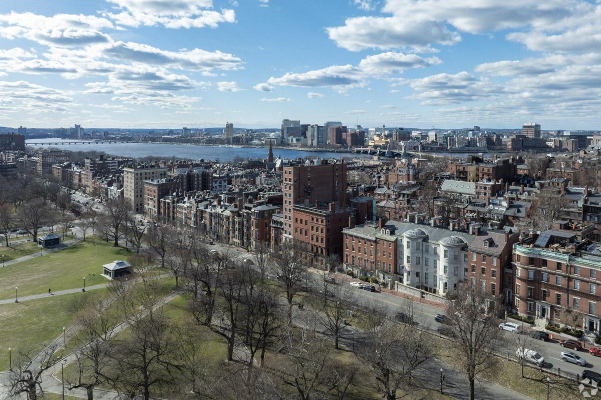 Beacon Hill sits across the street from the Boston Common and borders the Charles River.