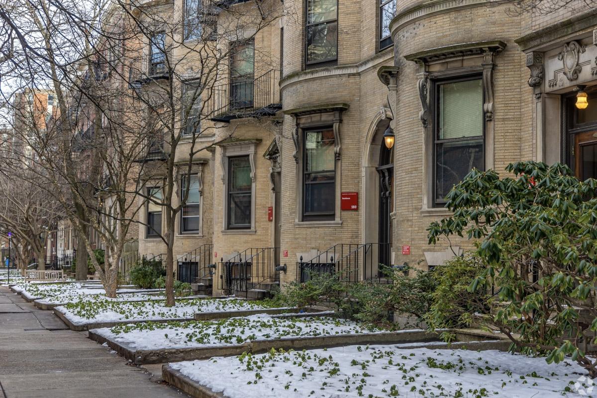 Ornate rowhouse facades line a street in the Fenway neighborhood of Boston.