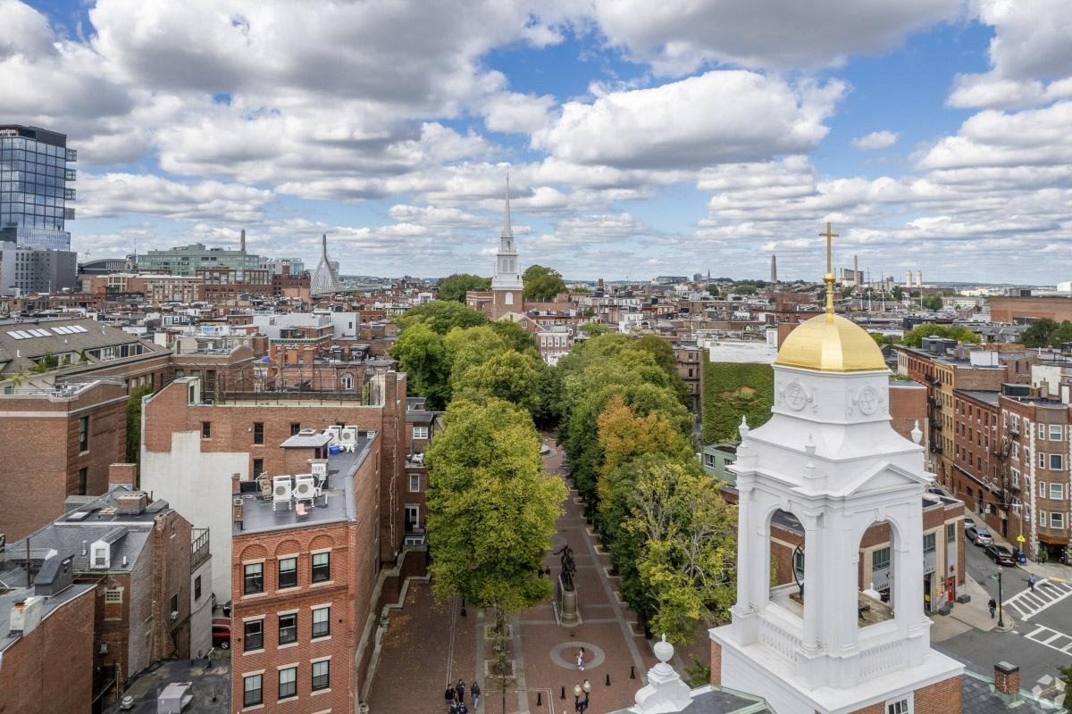 An aerial view of Freedom Trail shows St. Stephen’s Catholic Church in the foreground and Old North Church in the background.