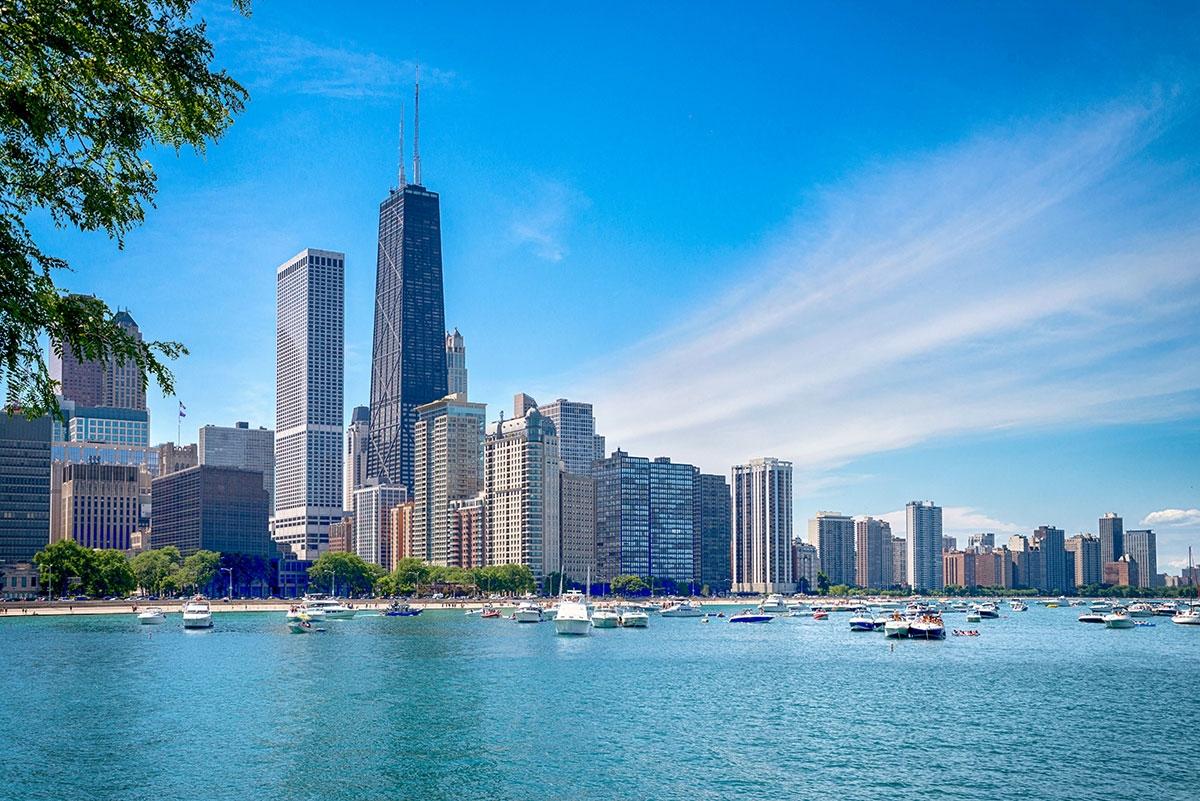 The Chicago skyline rises above a blue Lake Michigan.