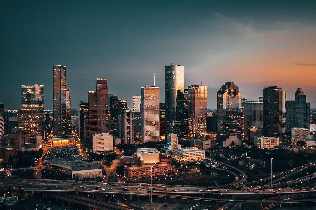 Houston's skyscrapers light up as the evening falls.