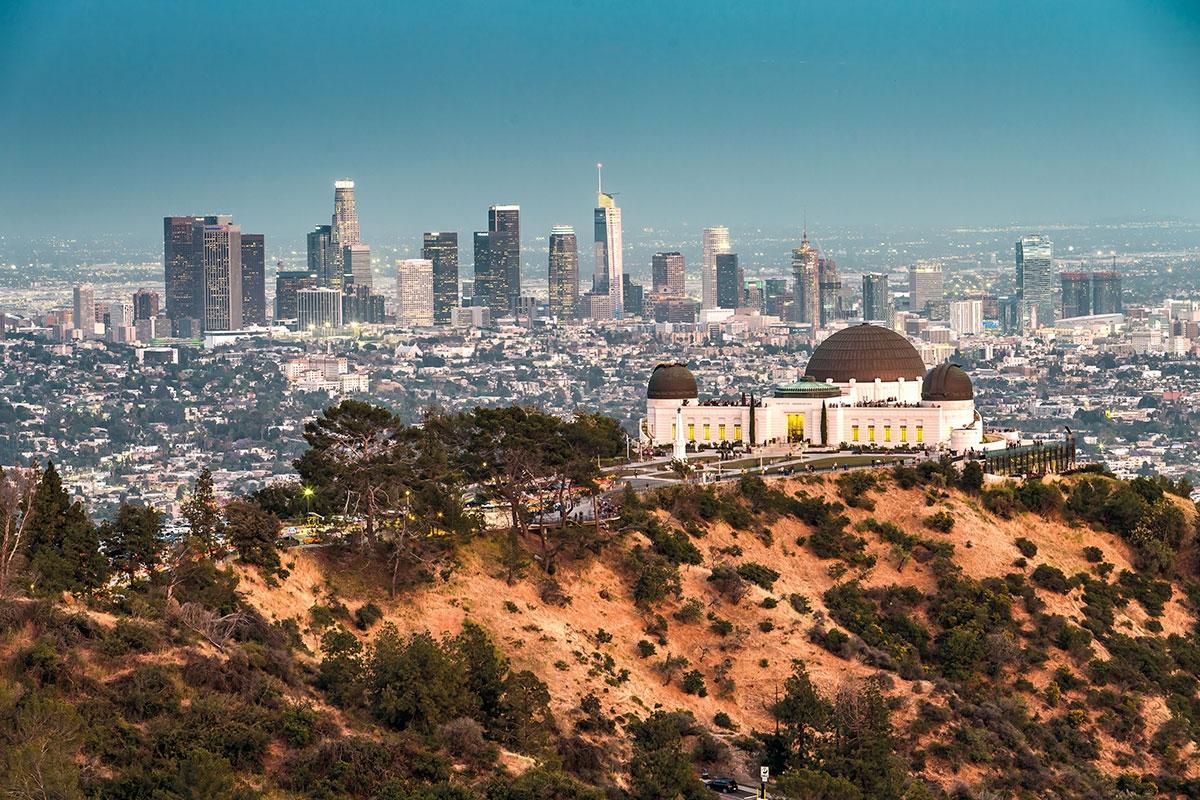 The Griffith Observatory sits in front of the Los Angeles skyline.