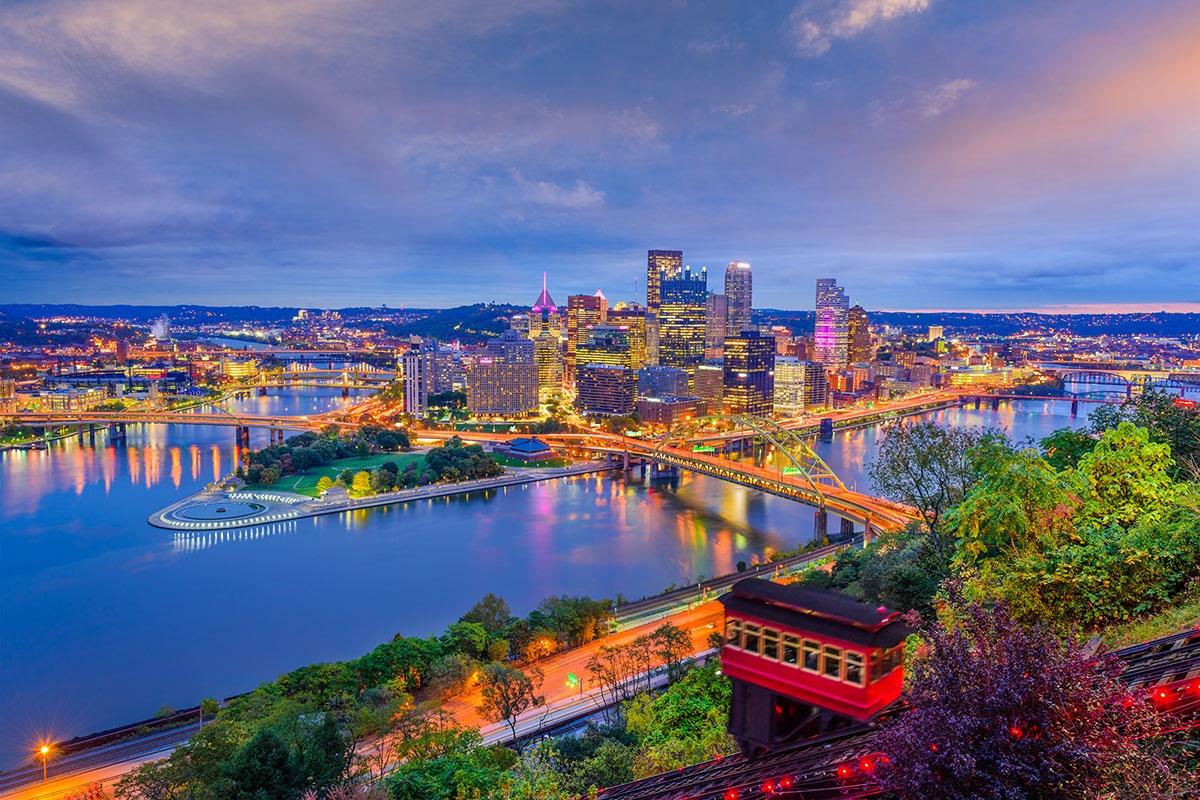 Downtown Pittsburgh lights up where the Allegheny and Monongahela River meet to form the Ohio River.