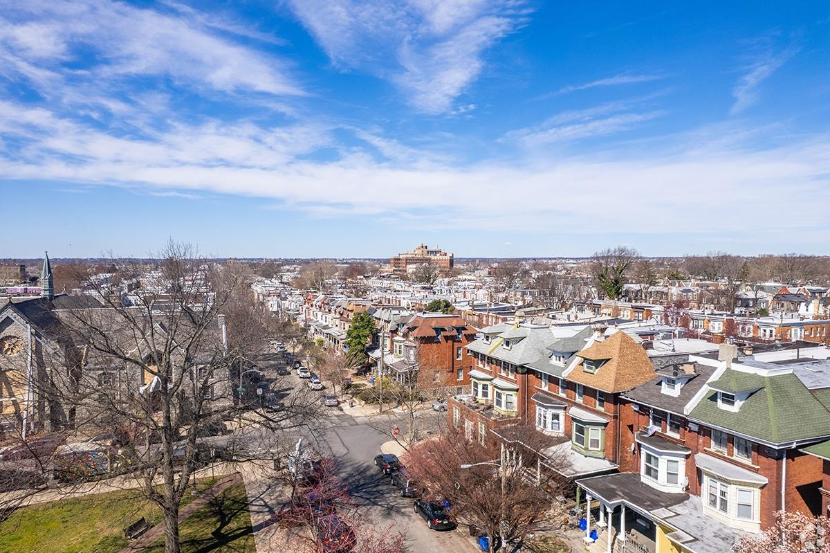 An aerial view of the Cobbs Creek neighborhood shows quaint rowhomes.