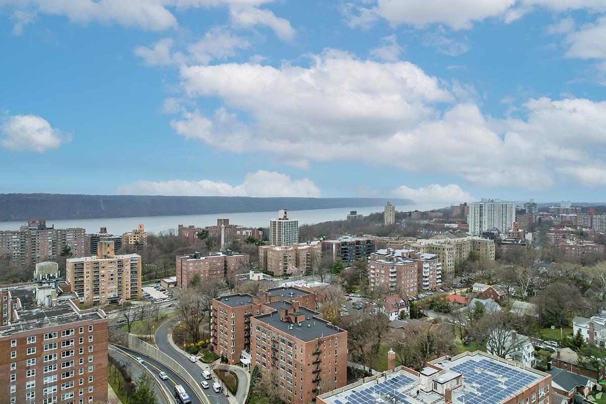 An aerial view of Riverdale shows apartment communities along the Hudson River.