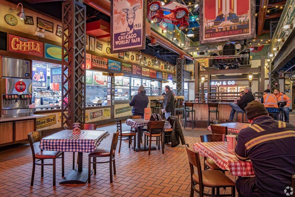 A large food hall filled with bright and colorful decorations