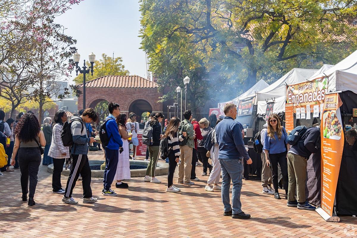 People queue up to try delicious cuisine at a food festival in Los Angeles.