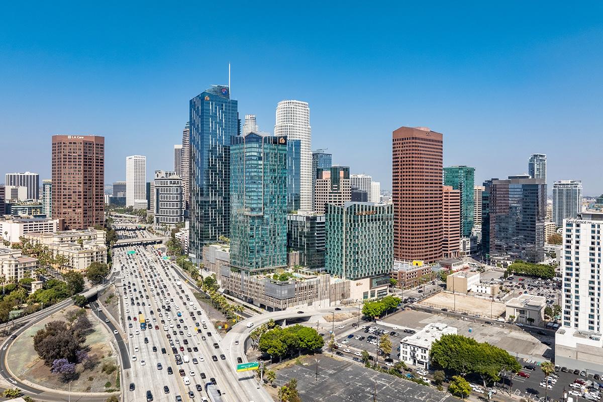 A highway in downtown Los Angeles is packed with cars.