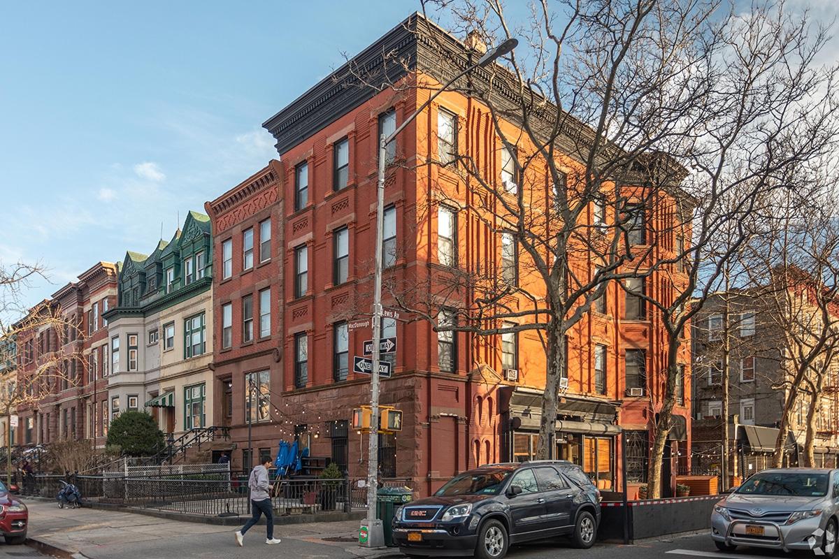 Walk-up apartments sit above a restaurant in Bed-Stuy.