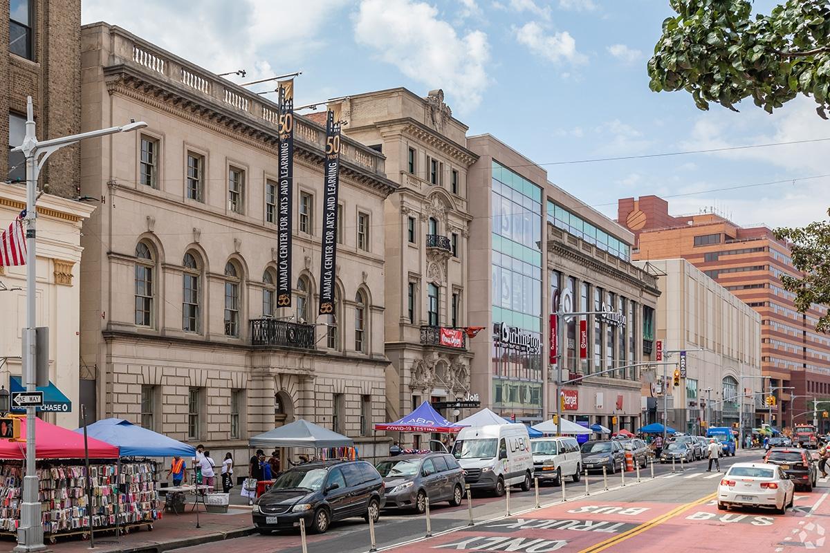 National retailers and local vendors line a street in Southeast Queens.