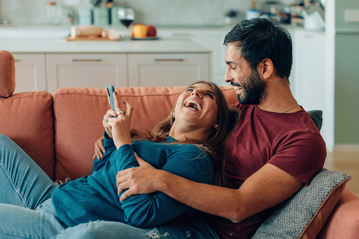 Couple in apartment lounging