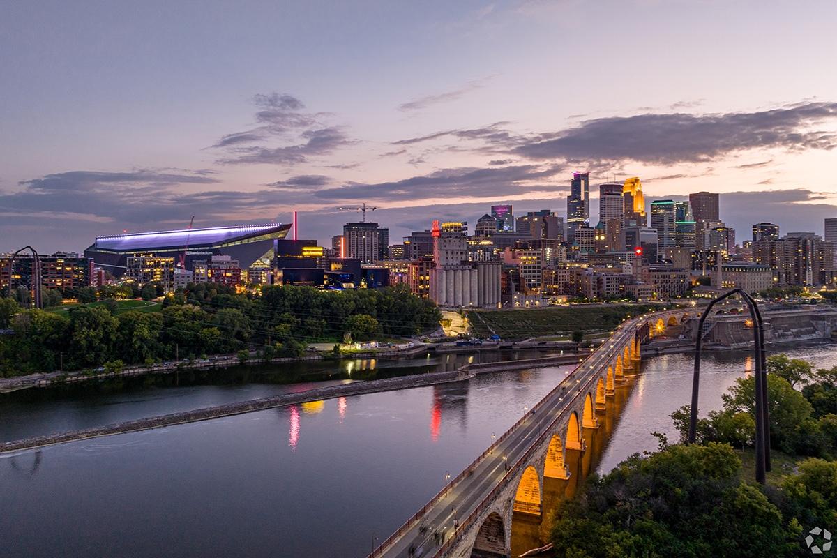 The Stone Arch Bridge lights the way to Downtown East, Mill City Ruins Park, and Minneapolis.