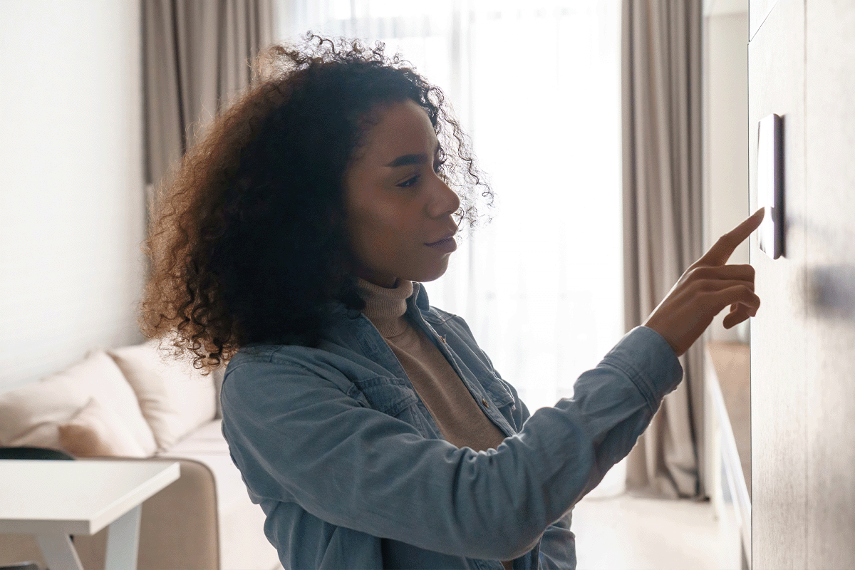 Woman using apartment security feature