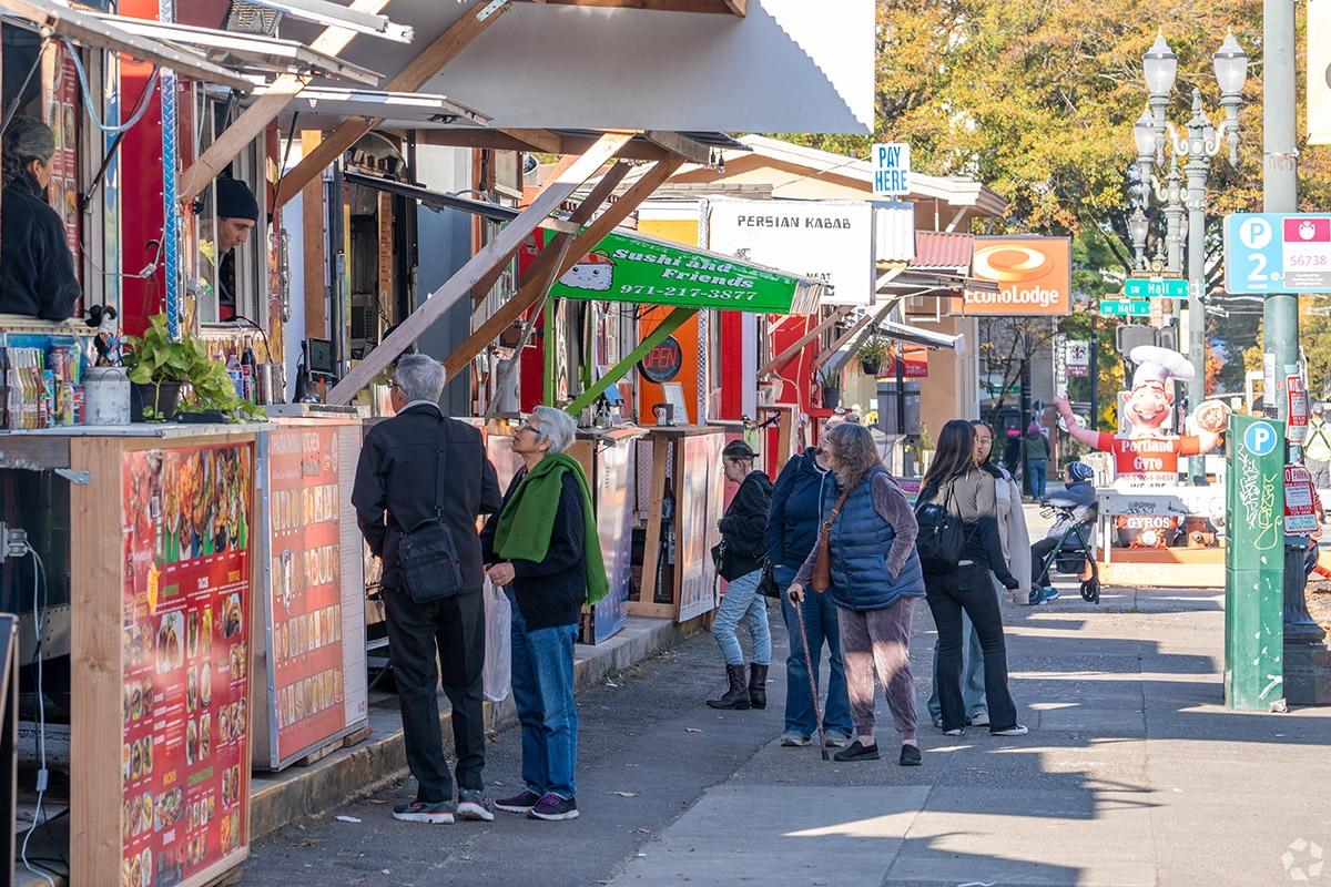 People line up at food stalls to try out Portland's food scene.