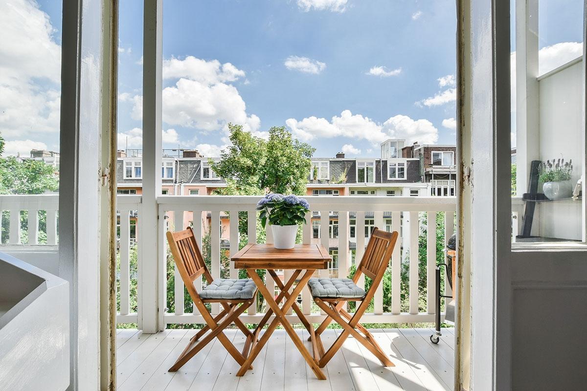 Small-space furniture on apartment balcony.