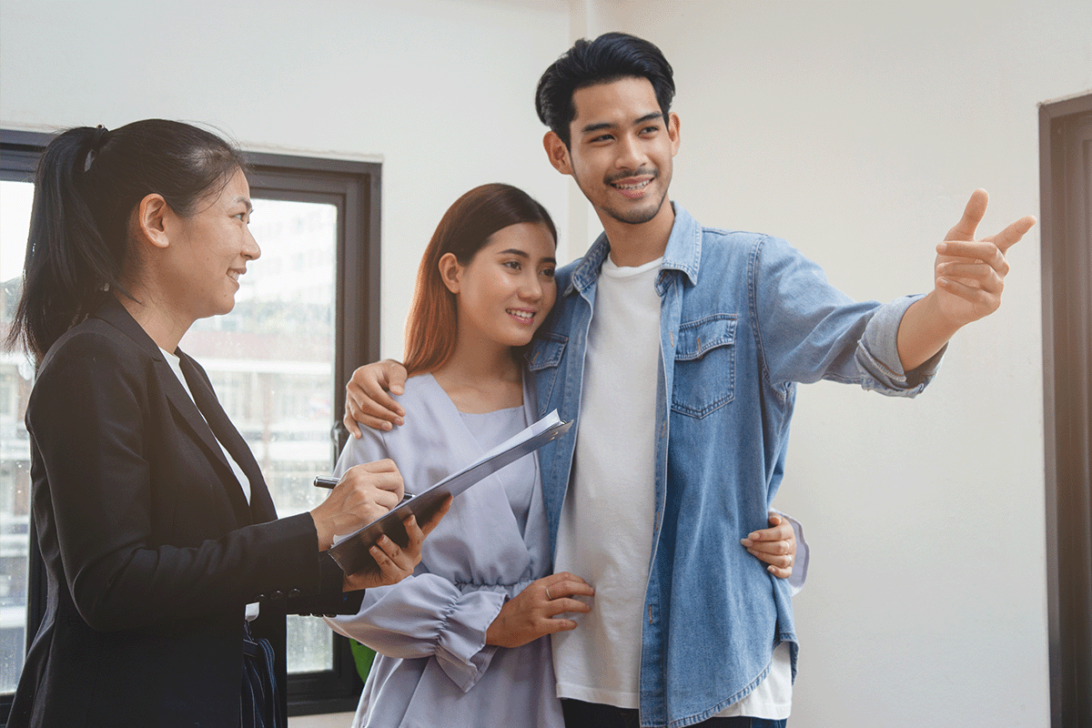 Couple speaking to a leasing agent