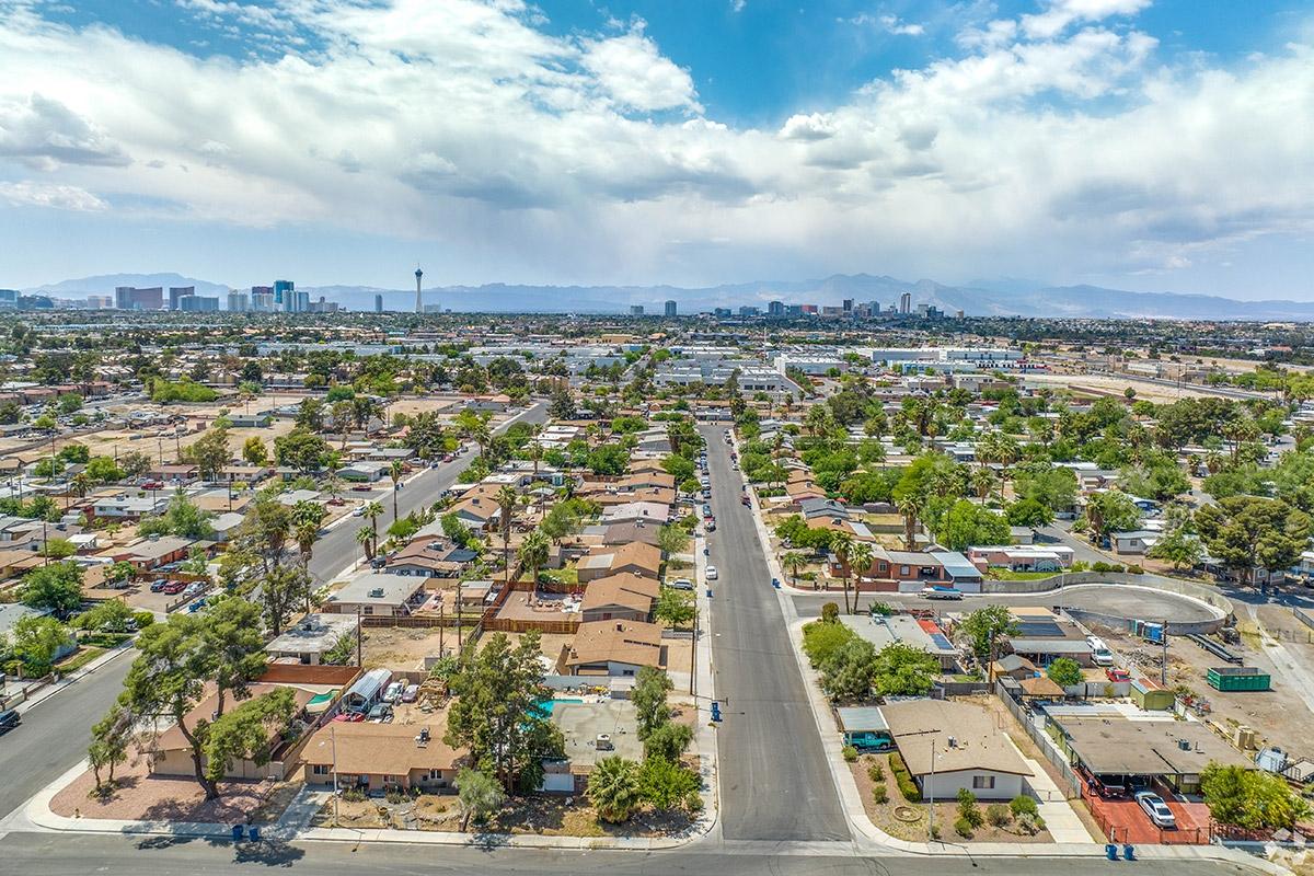 Homes and apartment communities stretch out in tree-filled neighborhoods with the Strip far in the distance in Downtown East.