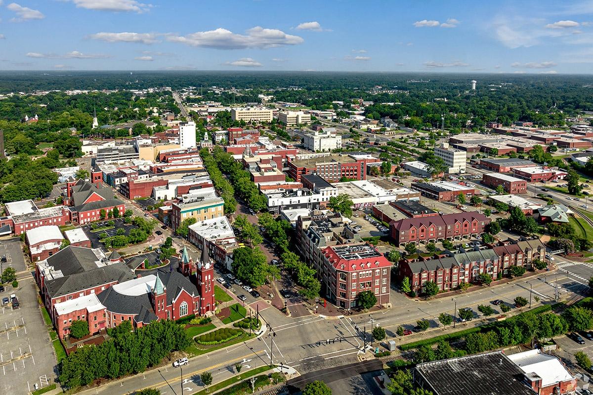 Downtown Fayetteville is covered in historic, brick buildings with tree-lined streets.