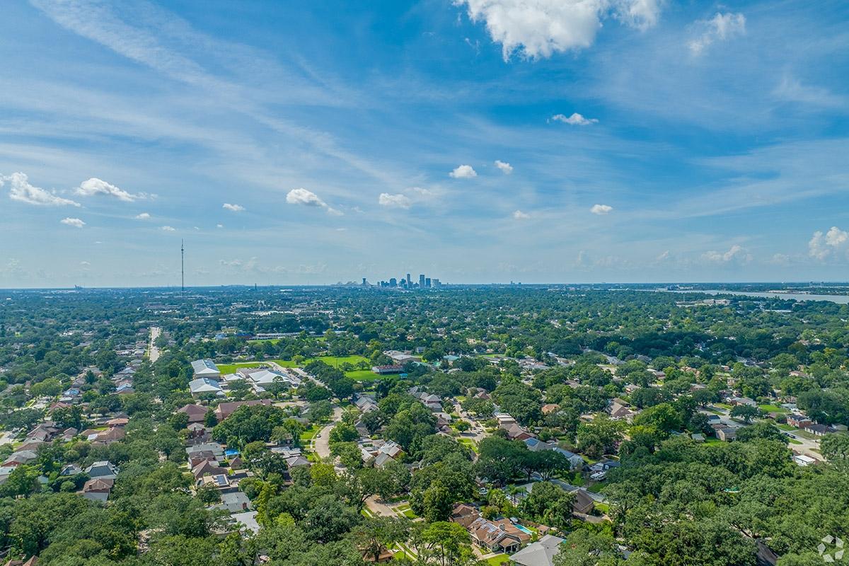 Old Aurora is a tree-covered neighborhood far across the Mississippi River from Downtown New Orleans.