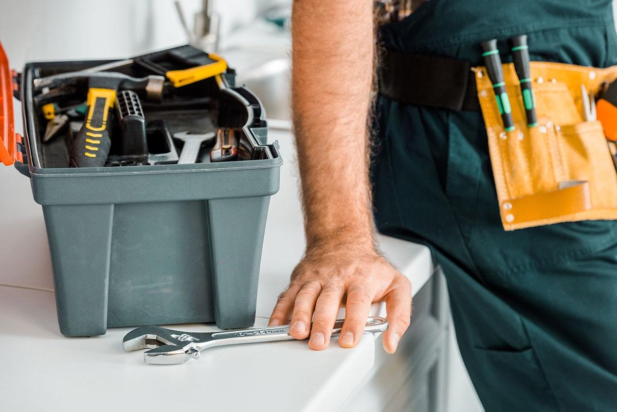 Handyman fixing apartment based on security deposit deductions.