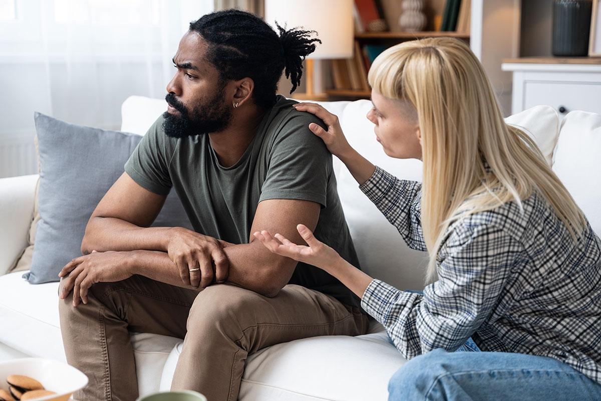A man and woman roommate arguing.
