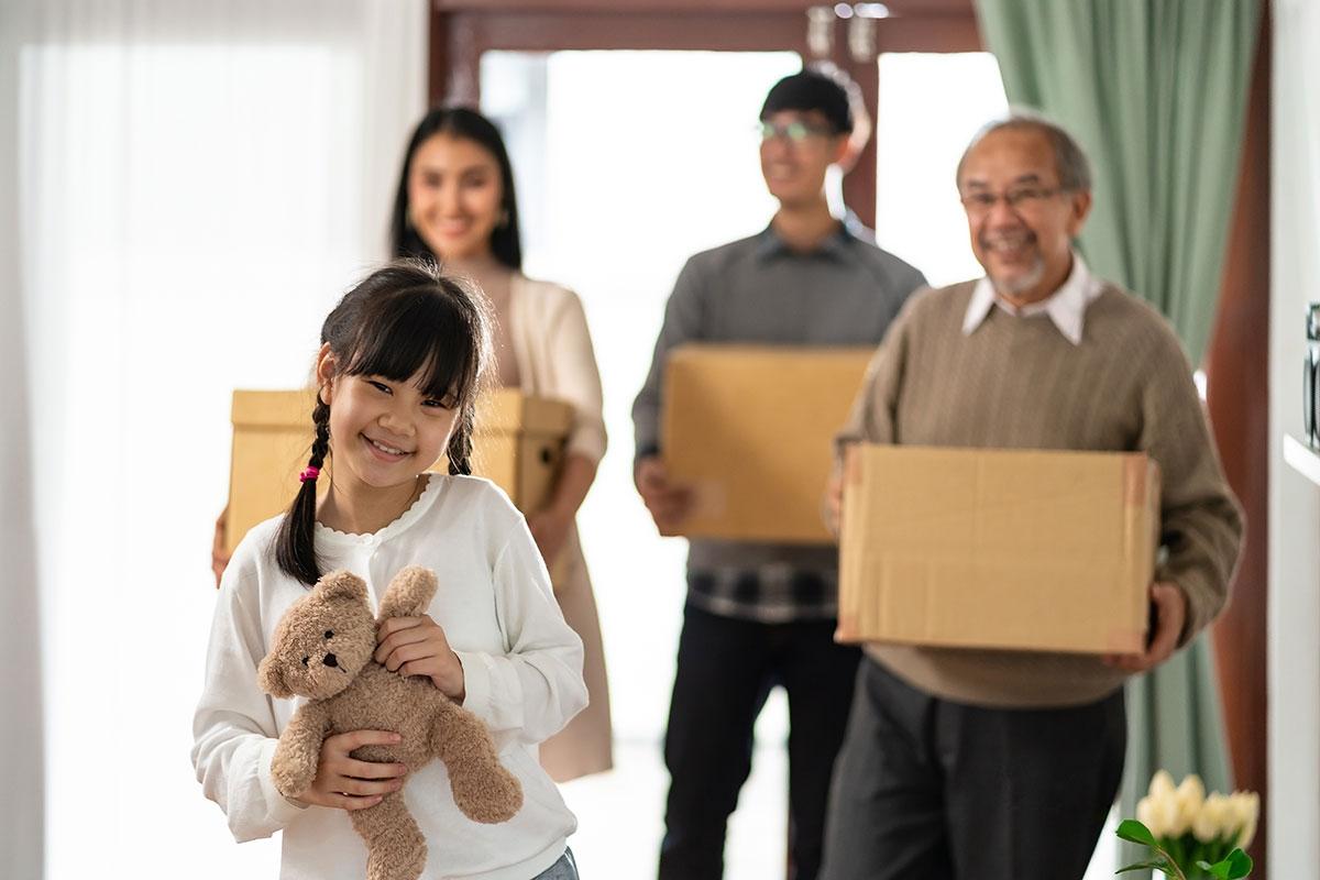 A multigenerational family moving into a new apartment.