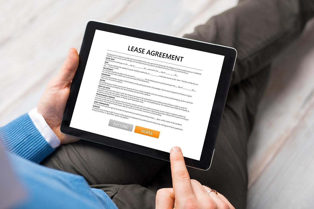 Person reviewing an online lease on their tablet.