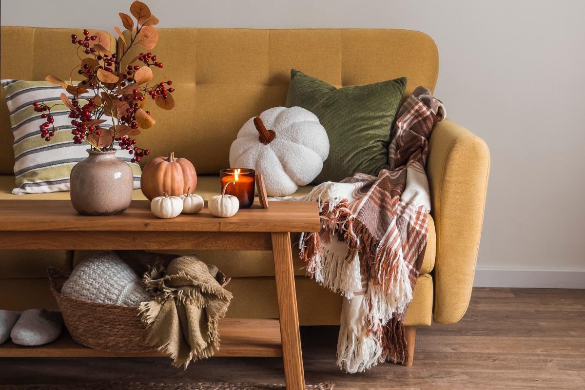 Mustard colored couch with fall decor